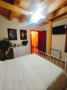 A bed or beds in a room at CASA RURAL LA TORRITA