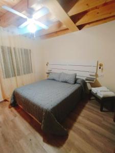 A bed or beds in a room at CASA RURAL LA TORRITA