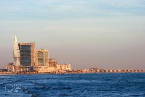 a view of a city from the water at Hotel 12 O'clock in Karachi