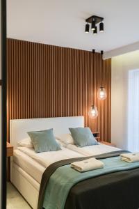 Posteľ alebo postele v izbe v ubytovaní Wilczak Apartment with FREE GARAGE Poznań by Noclegi Renters