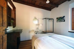 Postel nebo postele na pokoji v ubytování Ar Convént B&B