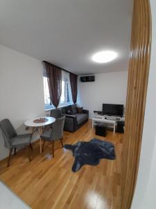 a living room with a dog rug on the floor at TALIJA in Vračar (historical)
