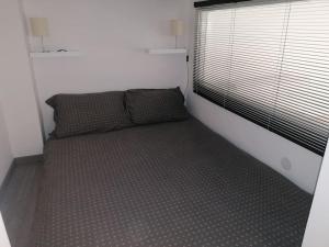 Posteľ alebo postele v izbe v ubytovaní BEM56 Apartman