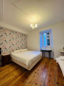 Llit o llits en una habitació de Hostel Baqueira - Refugi Rosta - PyrenMuseu