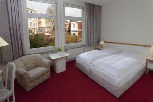 Cama o camas de una habitación en Gästehaus Kaiserhof Lübeck