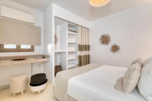 Postel nebo postele na pokoji v ubytování Amalgam Homes Paros
