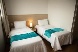 Postel nebo postele na pokoji v ubytování Hotel Franco