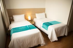 Postel nebo postele na pokoji v ubytování Hotel Franco