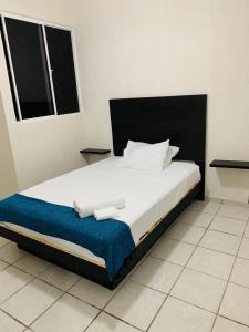 Krevet ili kreveti u jedinici u objektu Departamento nuevo en Aldea Tulum, alberca e internet