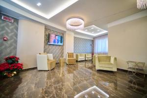 TV a/nebo společenská místnost v ubytování PARK HOTEL LE DUNE DI GIOVINO