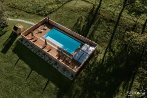 an overhead view of a boat with a swimming pool at Domačija Metul in Luče