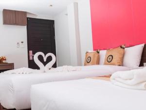 Postel nebo postele na pokoji v ubytování Royal Asia Hotel Pratunam