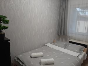 Postel nebo postele na pokoji v ubytování Nikolett apartman
