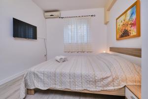 Posteľ alebo postele v izbe v ubytovaní Appartment Ksenija 2