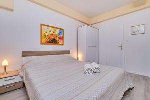 Posteľ alebo postele v izbe v ubytovaní Appartment Ksenija 2