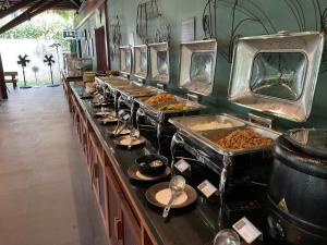 a buffet line with many dishes of food at Avatar Railay in Railay Beach