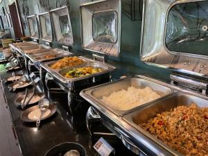 a buffet line with many trays of food at Avatar Railay in Railay Beach