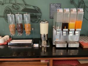 a counter top with a bunch of different types of drinks at Avatar Railay in Railay Beach