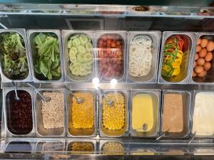 a bunch of containers filled with different types of food at Avatar Railay in Railay Beach