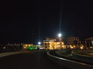 a building at night with lights in front of it at Flamingo Club and Resort Una 3 Km Away from Diu Check Post in Diu
