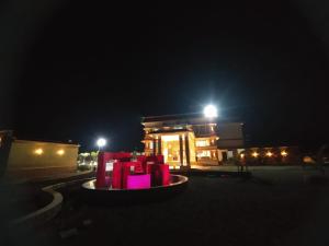 a pile of presents in front of a gas station at night at Flamingo Club and Resort Una 3 Km Away from Diu Check Post in Diu