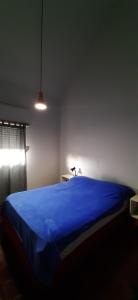 Una cama o camas en una habitación de Departamentos San Rafael Mendoza