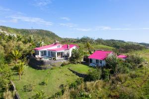 an aerial view of a house with a pink roof at Villa Lorizon in Rodrigues Island