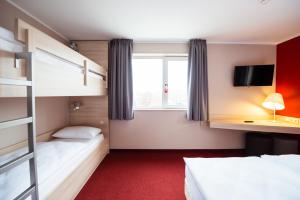 Postel nebo postele na pokoji v ubytování Serways Hotel Spessart
