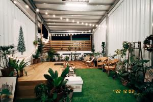 a room filled with lots of potted plants at 1981 Hostel in Taitung City