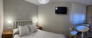 Postel nebo postele na pokoji v ubytování Apartamentos Casa Isabale