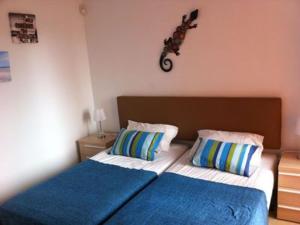 En eller flere senger på et rom på Lovely 2 Bed Apartment in Los Alcazares