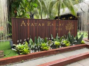 a sign for a waarar railway with plants at Avatar Railay in Railay Beach