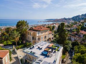 an aerial view of a house with a view of the ocean at Le Vallaya Suites & Spa in Menton