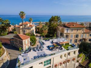 an aerial view of a building with a patio and the ocean at Le Vallaya Suites & Spa in Menton