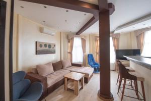 a living room with a couch and a table at Club Satelit Zlatibor in Zlatibor