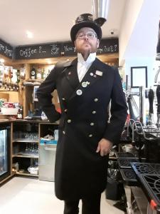 a man in a suit and hat standing in a store at Nelthorpe Arms in Barton-upon-Humber