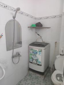 a small bathroom with a toilet and a sink at Homestay 846/B53 in Vung Tau