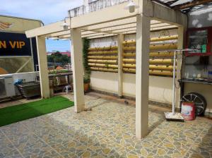 a pergola on the side of a building at Homestay 846/B53 in Vung Tau