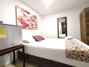 Ein Bett oder Betten in einem Zimmer der Unterkunft Walena Hotel