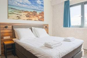 Postel nebo postele na pokoji v ubytování Harbour Hotel IJmuiden + 8 fotografií