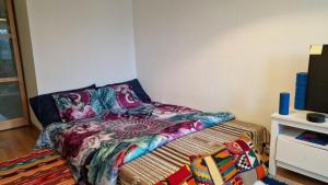 מיטה או מיטות בחדר ב-Artisouk