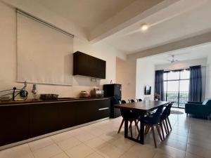 a kitchen and dining room with a table and chairs at Imperio Professional Suite by IMPERIO HAFFA in Alor Setar