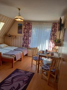 Posteľ alebo postele v izbe v ubytovaní Pokoje gościnne Tessa
