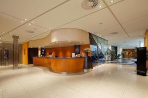 a lobby with a reception desk in a building at HCC Montblanc in Barcelona