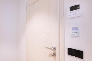 a door with a tv on the wall at Palazzo Chimelli in Pergine Valsugana