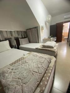 Кровать или кровати в номере Marina's Rooms