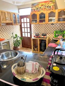 a kitchen with a sink and a counter top at we are one apartment in Arusha