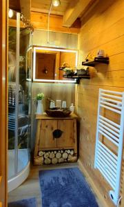 a small bathroom with a sink and a shower at Ferienhütten Zimmermann in Spital am Semmering +39 photos