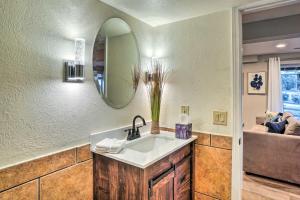 a bathroom with a sink and a mirror at 6 Mi to Dtwn Parker Serene Studio Suite! in Parker +16 photos