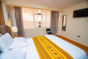 Un pat sau paturi într-o cameră la Departamentos KIRI para familias o empresas que viajan en grupo cerca al Aeropuerto Juliaca